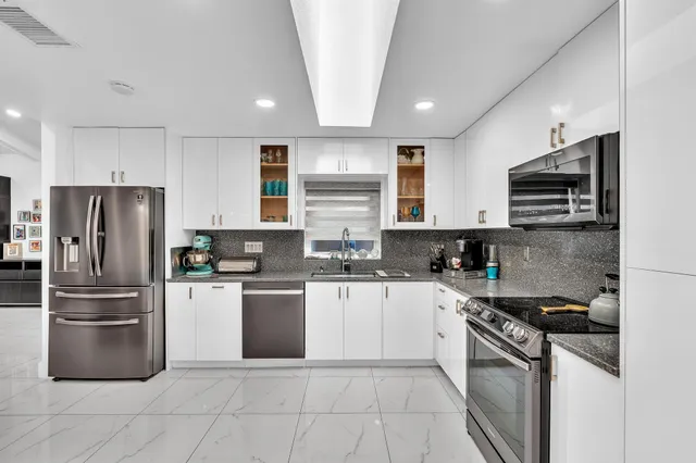 a bedroom with a bed and a flat tv screen
