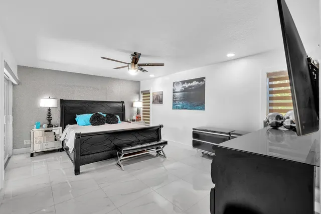 a view of a workspace with furniture and wooden floor