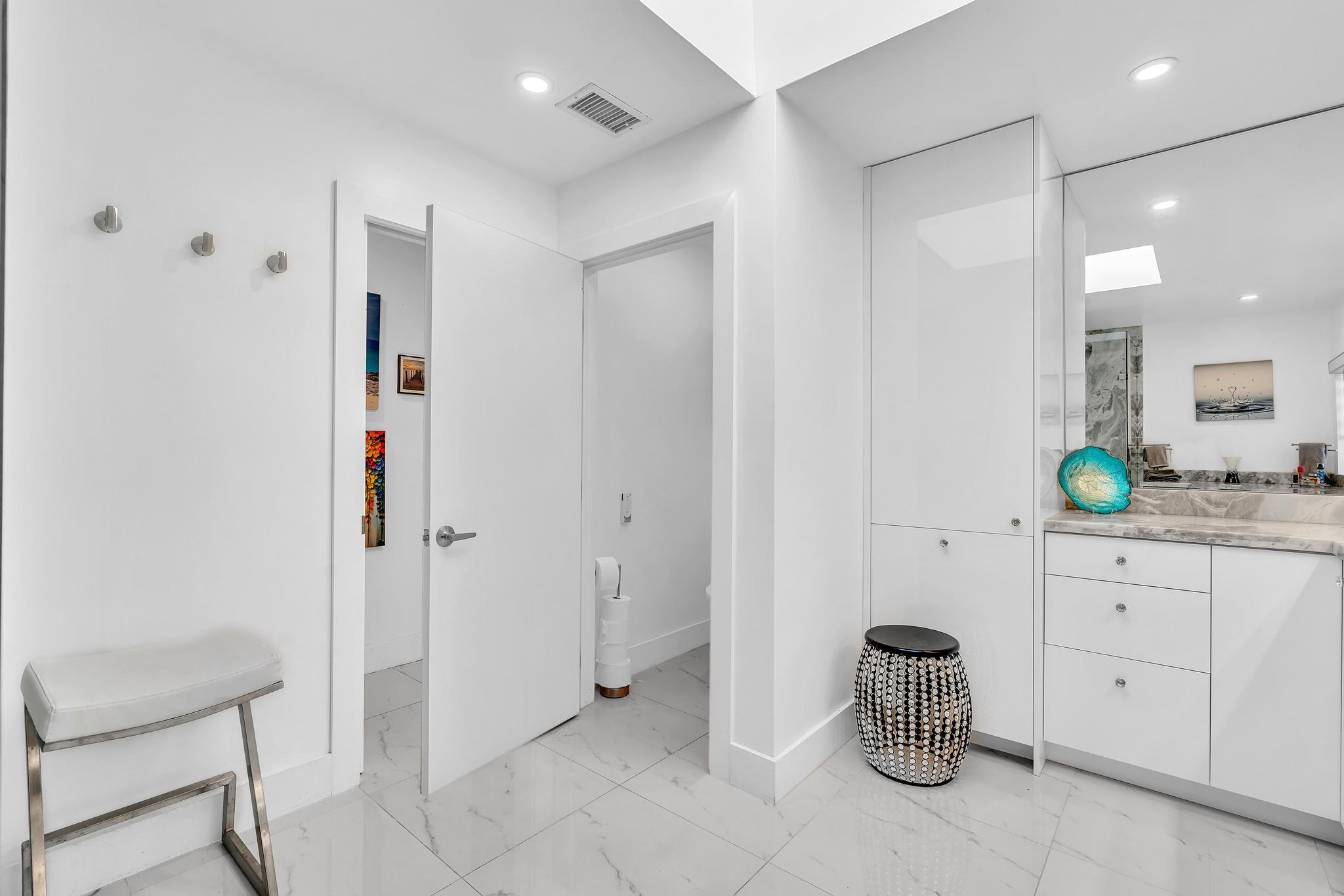20104 Back 9 Drive Boca Raton, FL 33498 - Photo 34 of 78 a kitchen with granite countertop a white table and chairs