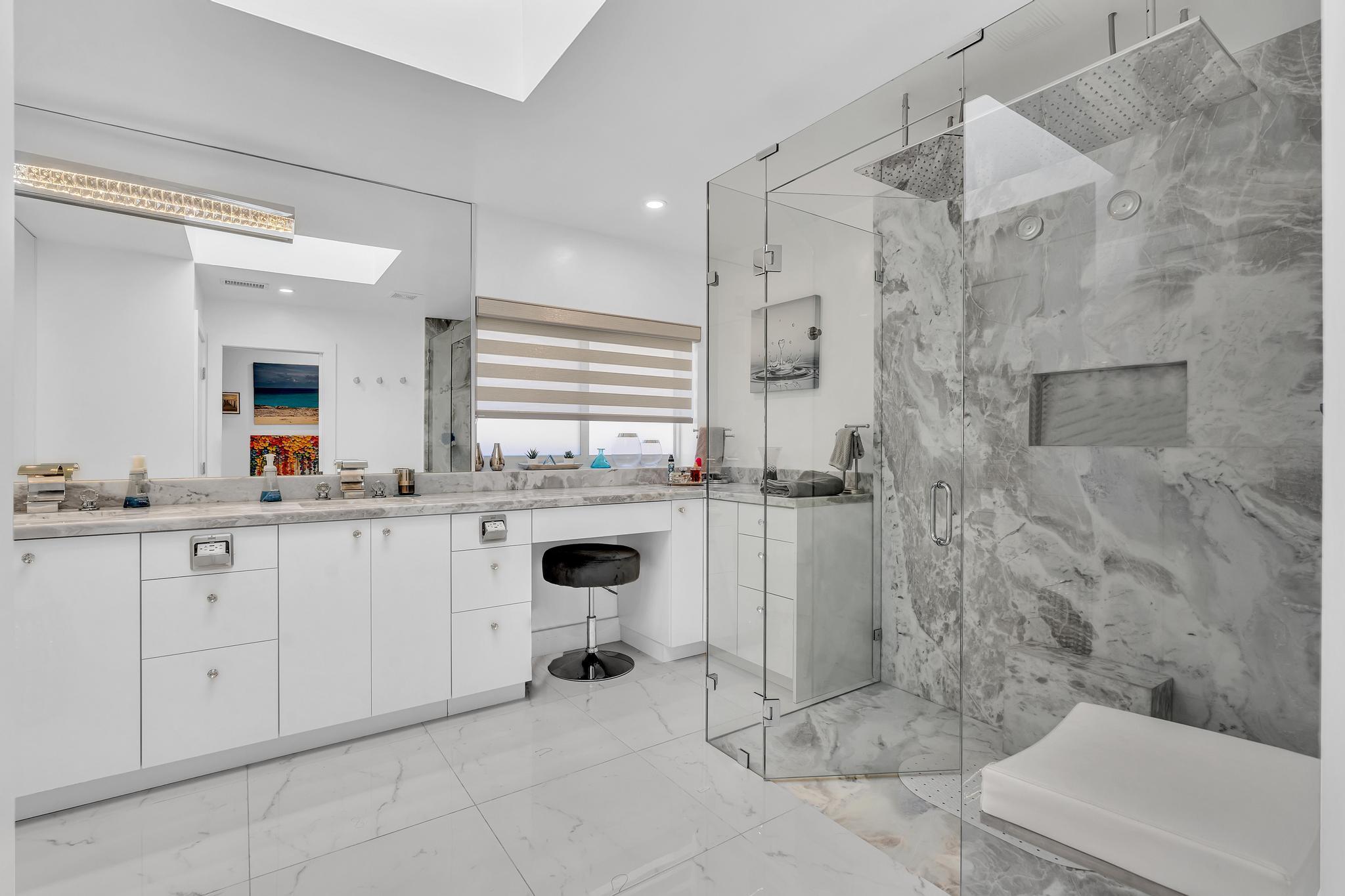 20104 Back 9 Drive Boca Raton, FL 33498 - Photo 36 of 78 a bathroom with a sink a toilet and shower