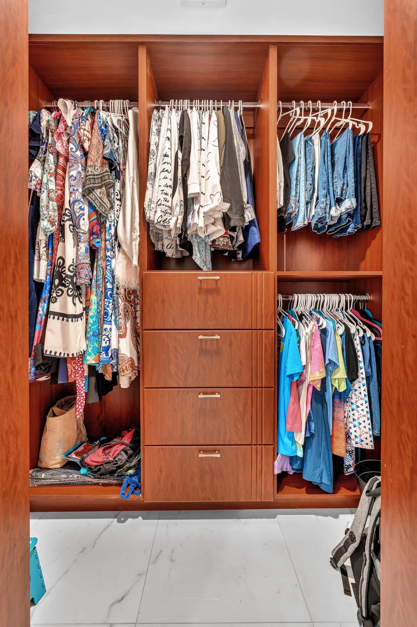 20104 Back 9 Drive Boca Raton, FL 33498 - Photo 38 of 78 a view of walk in closet with clothes and shoes