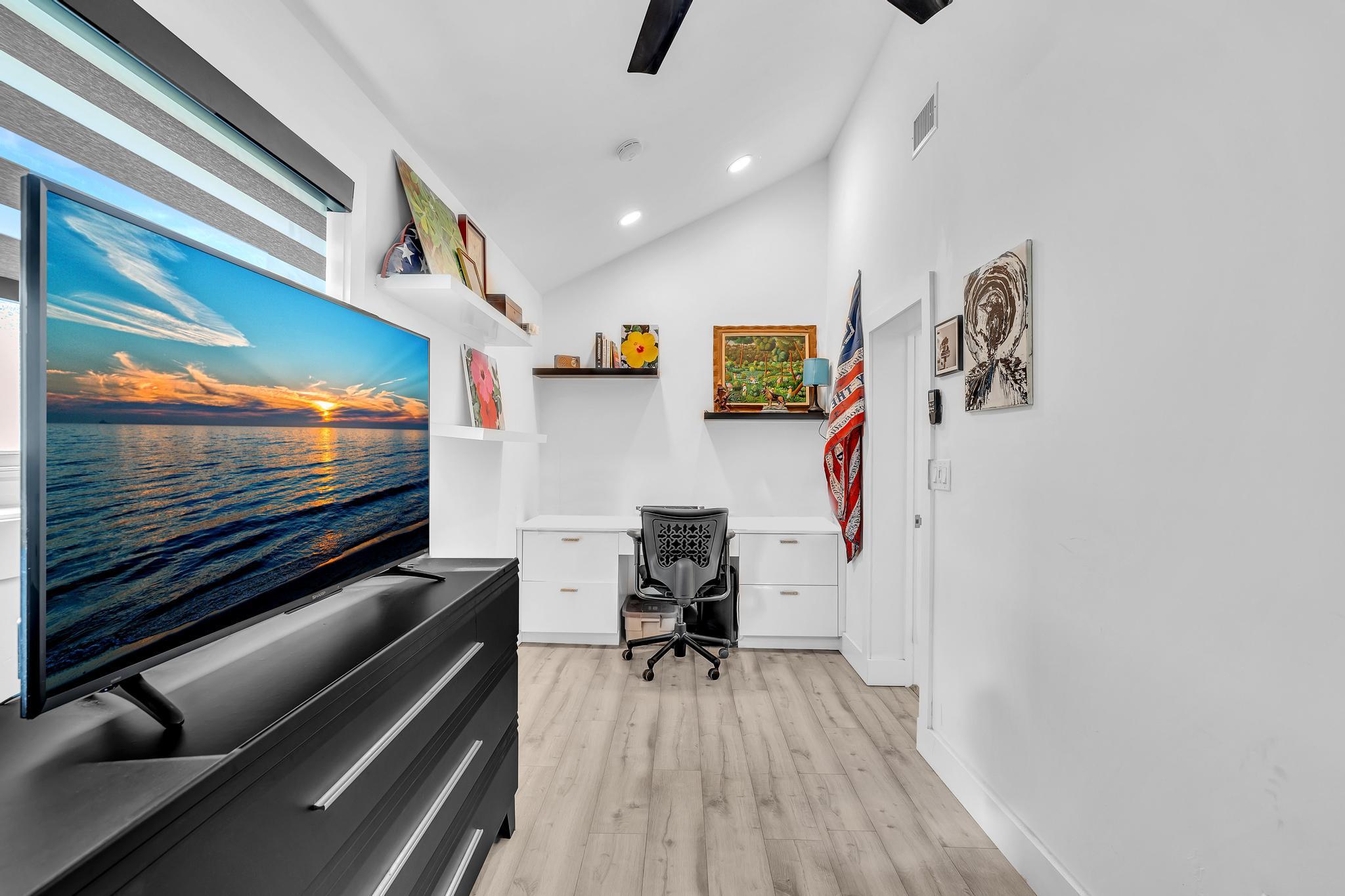 20104 Back 9 Drive Boca Raton, FL 33498 - Photo 46 of 78 a living room with furniture and a flat screen tv