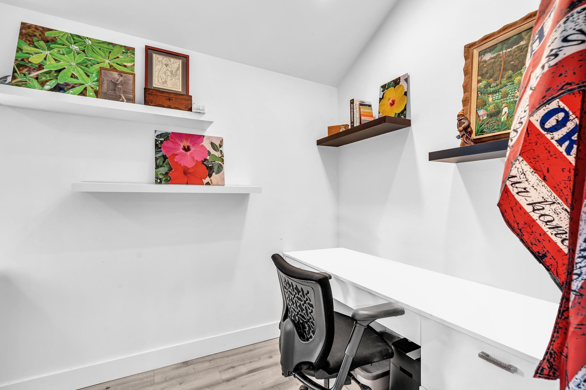 20104 Back 9 Drive Boca Raton, FL 33498 - Photo 48 of 78 a view of a workspace with furniture and wooden floor