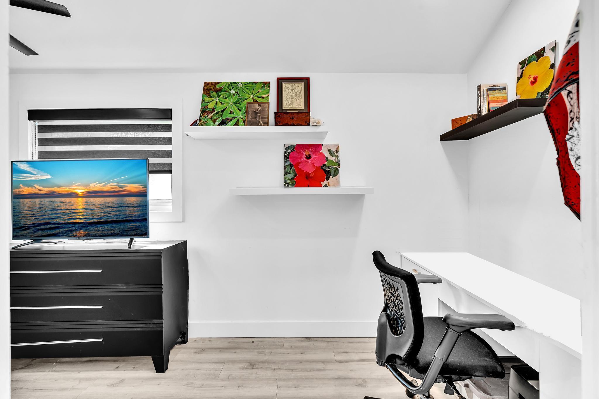 20104 Back 9 Drive Boca Raton, FL 33498 - Photo 49 of 78 a living room with furniture and a flat screen tv