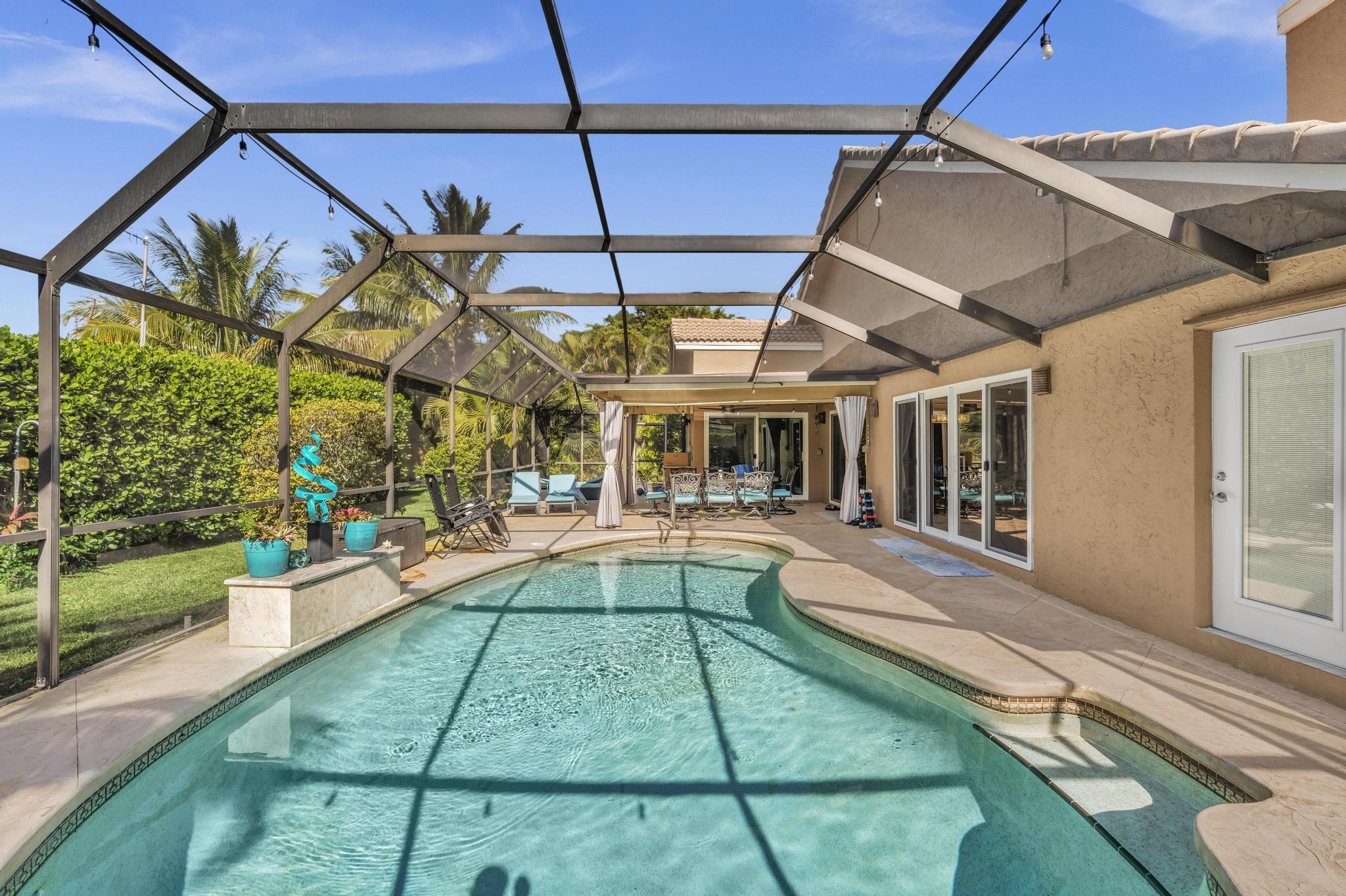 20104 Back 9 Drive Boca Raton, FL 33498 - Photo 61 of 78 a view of a house with a backyard