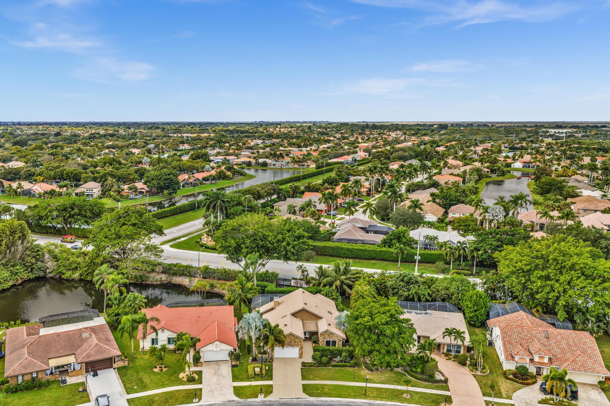 20104 Back 9 Drive Boca Raton, FL 33498 - Photo 75 of 78 an aerial view of residential houses with outdoor space and trees