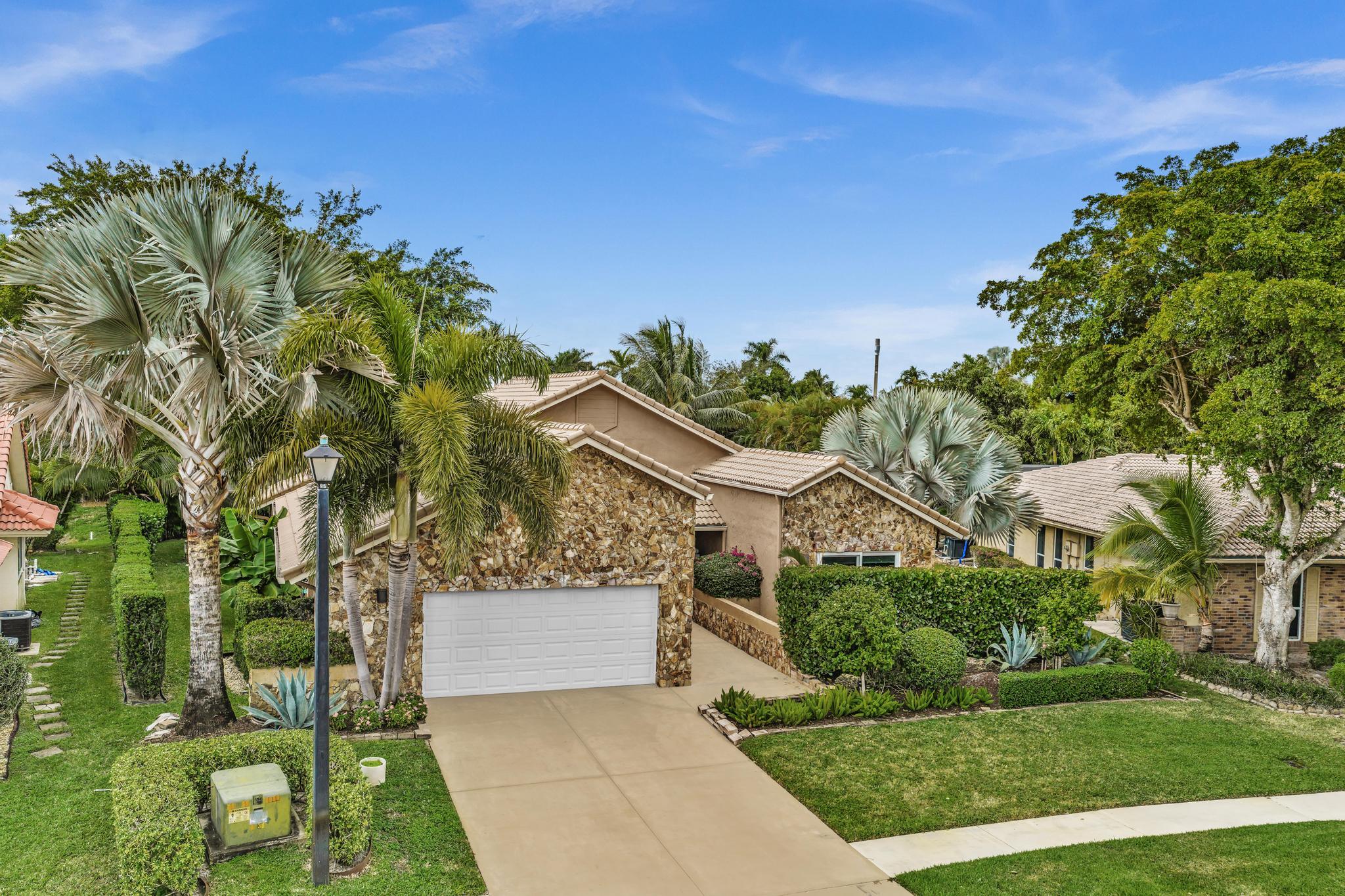 20104 Back 9 Drive Boca Raton, FL 33498 - Photo 77 of 78 a view of a house with a yard
