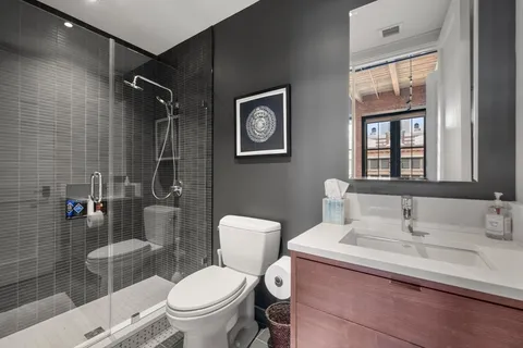 a bathroom with a toilet and a sink