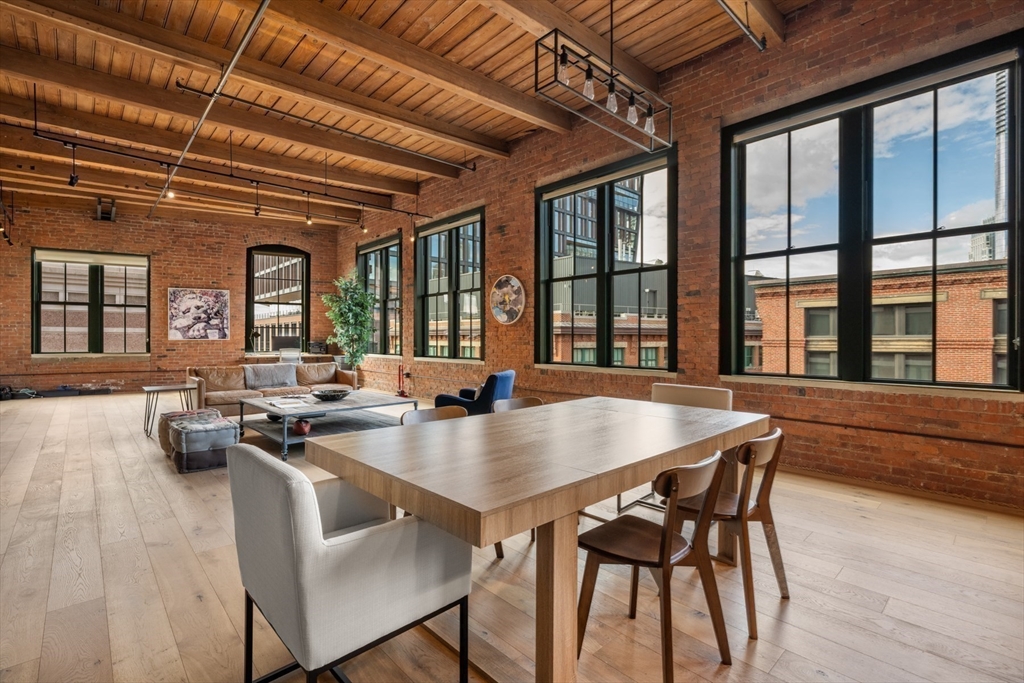 49 Melcher Street, Unit 502 Boston, MA 02210 - Photo 6 of 29 a view of a dining room with furniture window and outside view