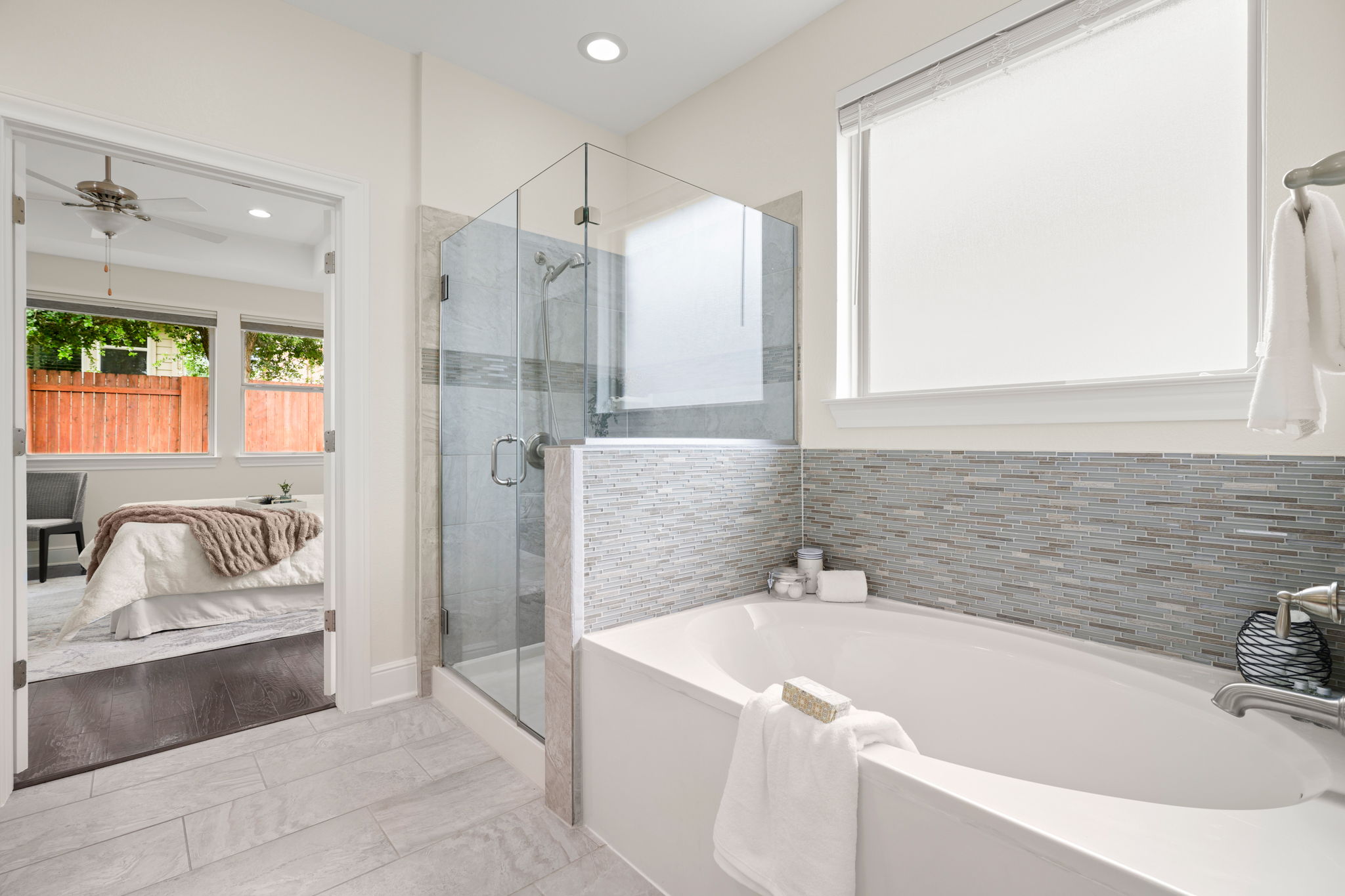 440 Cherokee Rose Circle Georgetown, TX 78626 - Photo 26 of 39 Luxurious soaking tub and glass-enclosed shower create a serene personal spa retreat.