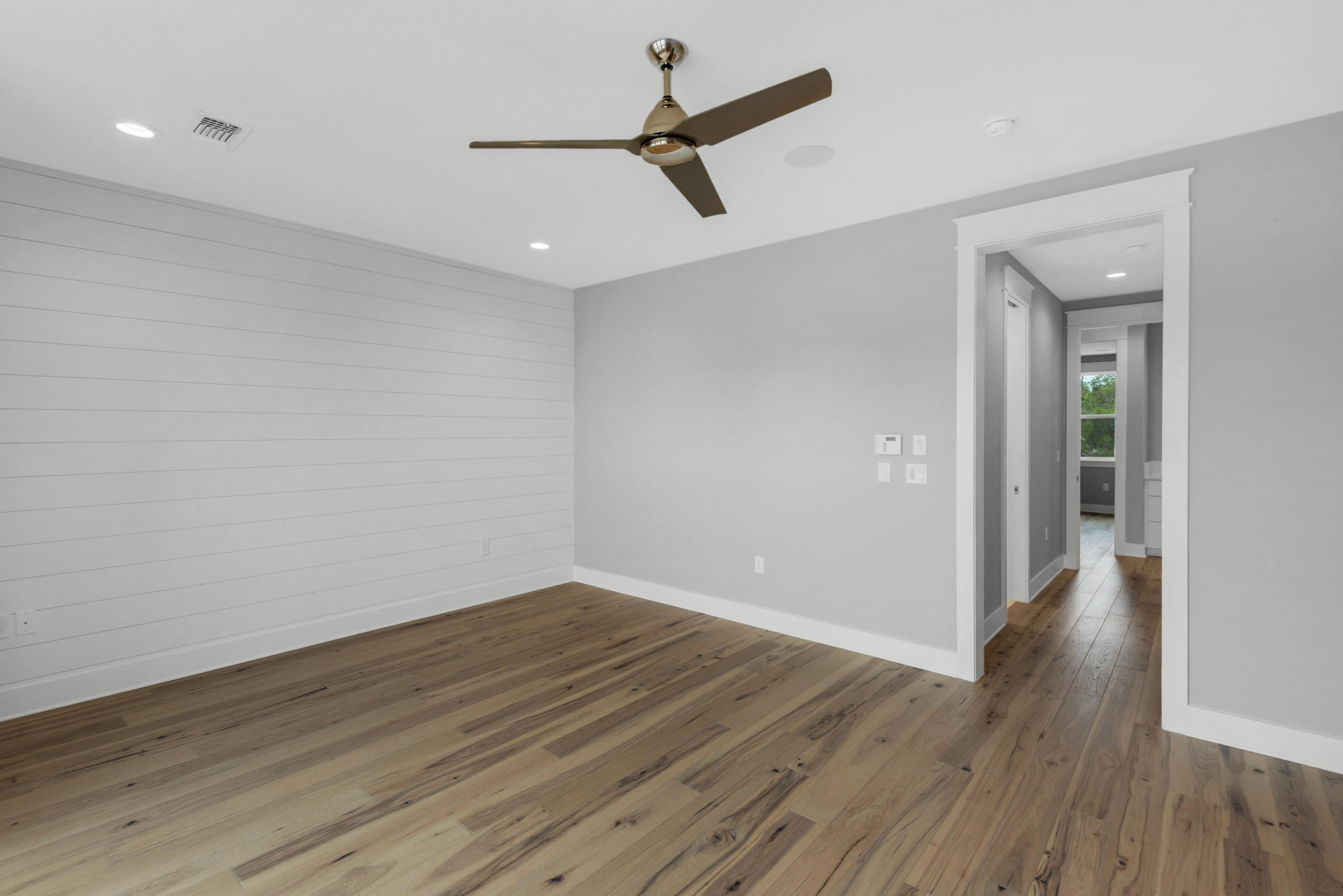 241 Ridgewalk Circle Santa Rosa Beach, FL 32459 - Photo 11 of 41 wooden floor in an empty room with a window