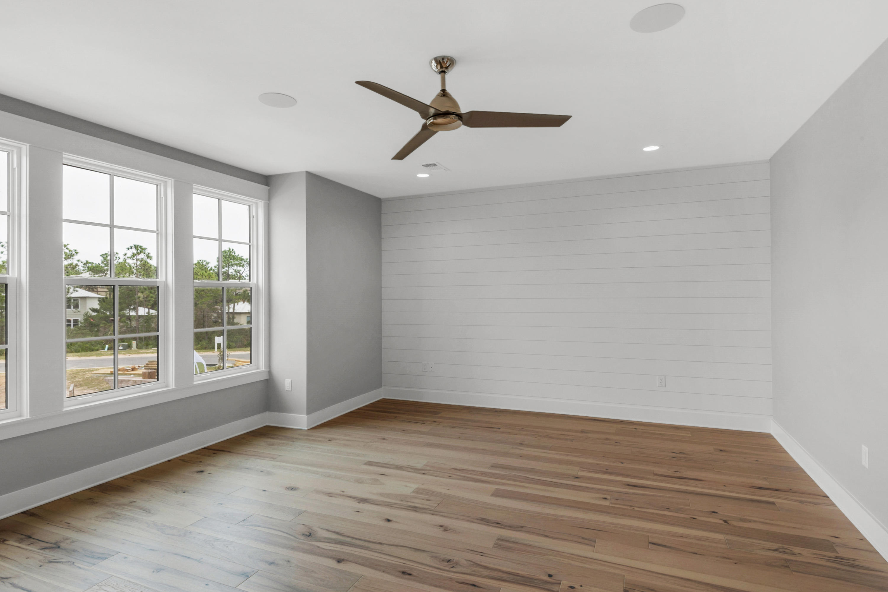 241 Ridgewalk Circle Santa Rosa Beach, FL 32459 - Photo 12 of 41 wooden floor in an empty room with a window