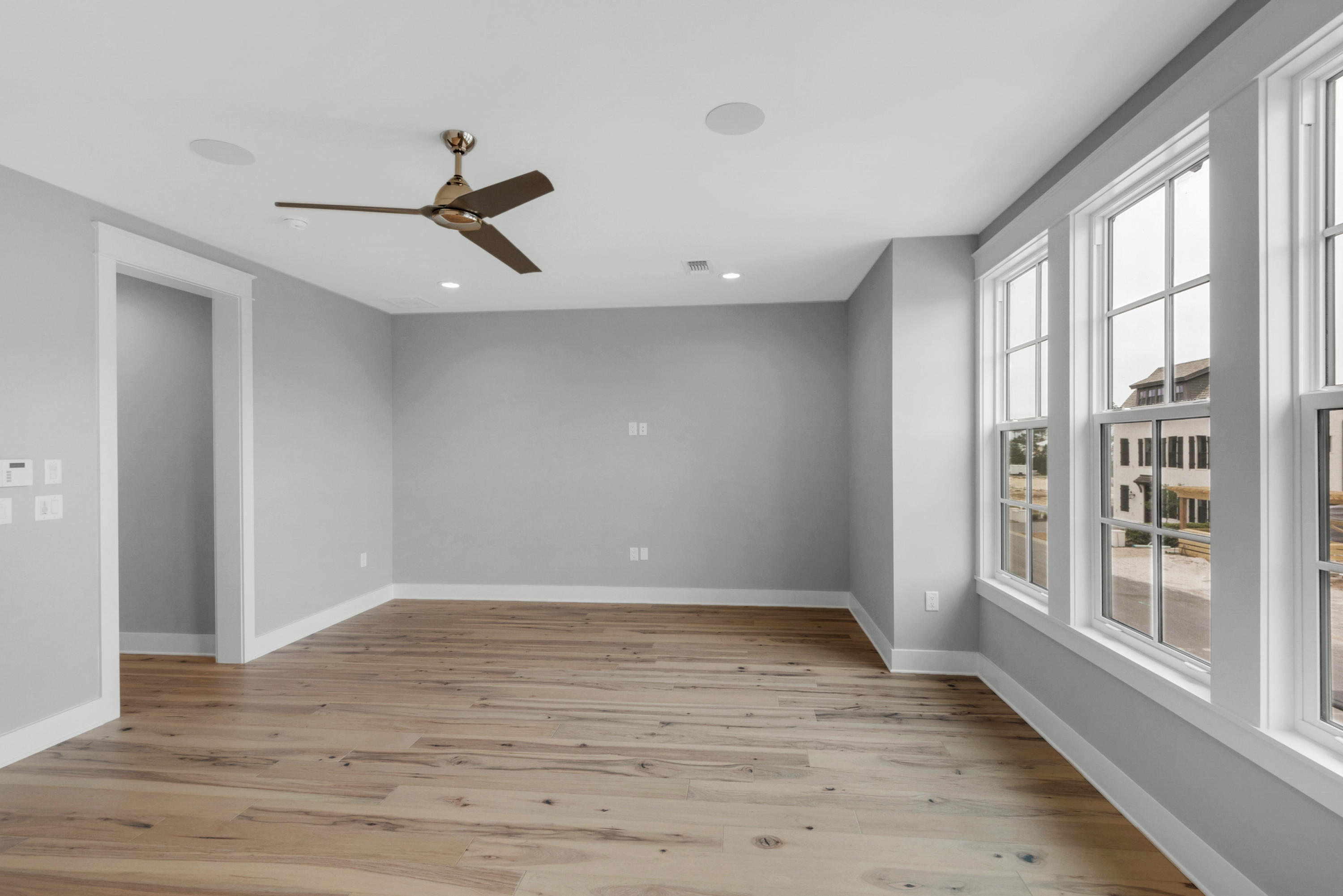 241 Ridgewalk Circle Santa Rosa Beach, FL 32459 - Photo 13 of 41 wooden floor in an empty room with a window