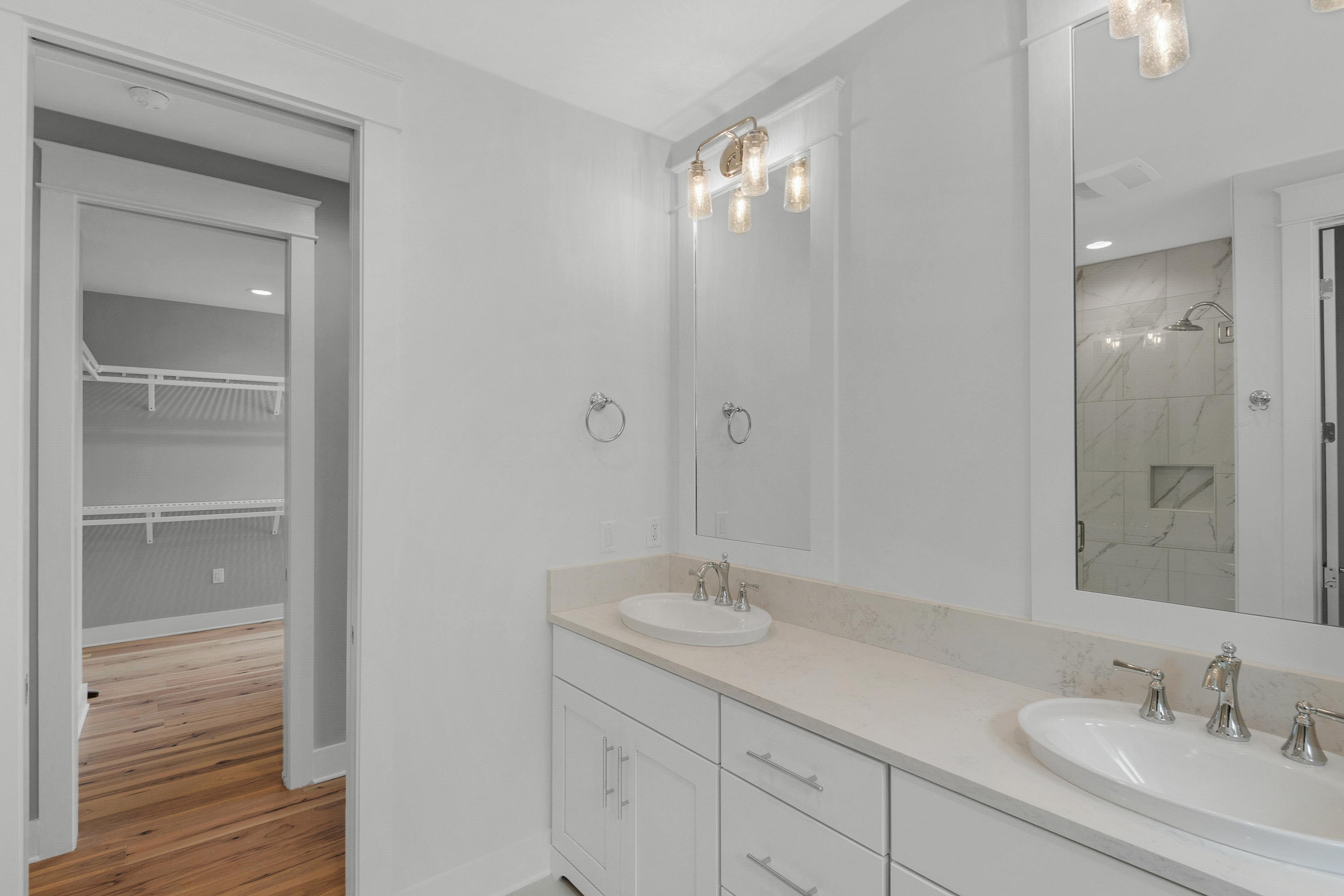 241 Ridgewalk Circle Santa Rosa Beach, FL 32459 - Photo 17 of 41 a bathroom with a sink double vanity and a mirror