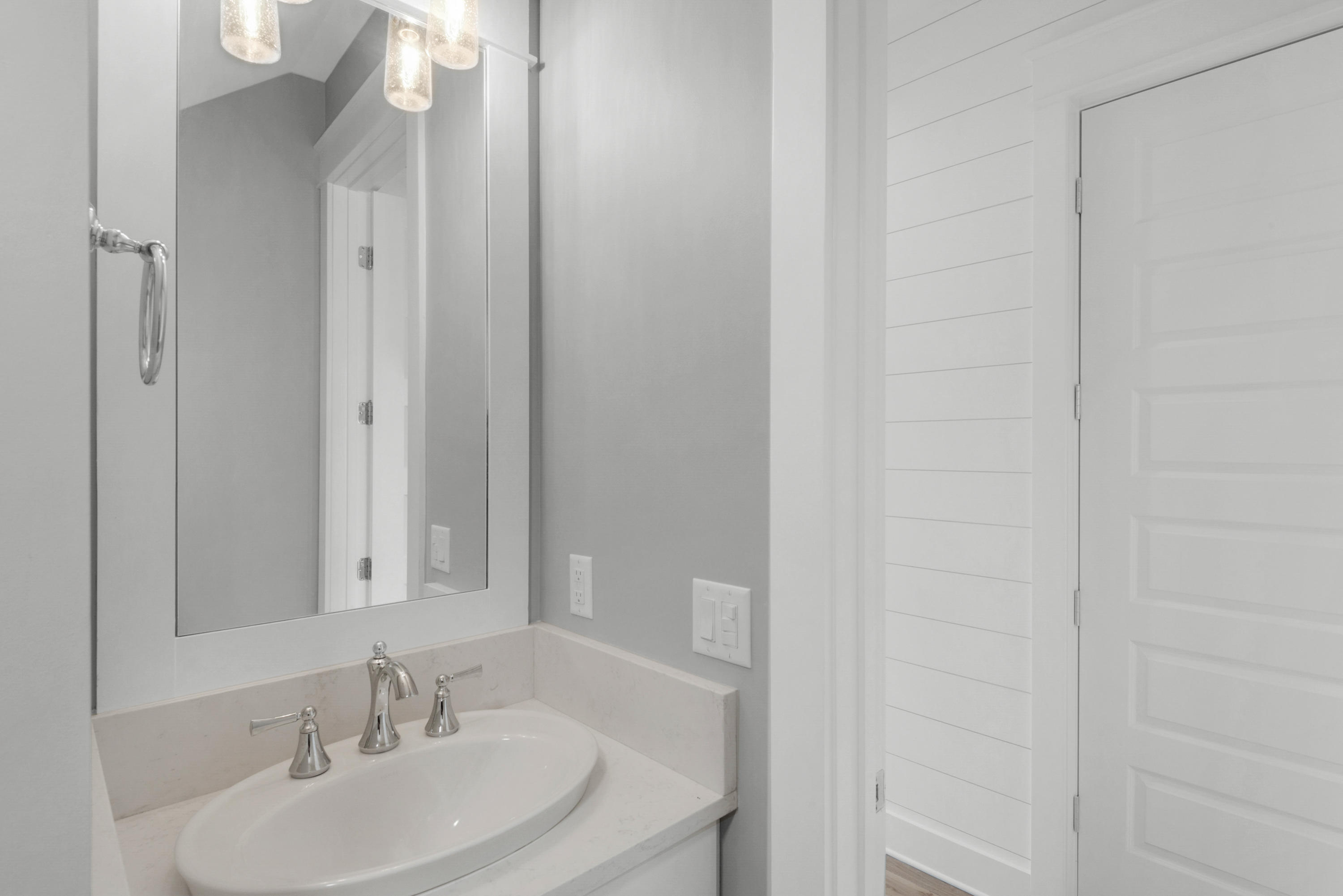 241 Ridgewalk Circle Santa Rosa Beach, FL 32459 - Photo 4 of 41 a bathroom with a sink and a mirror