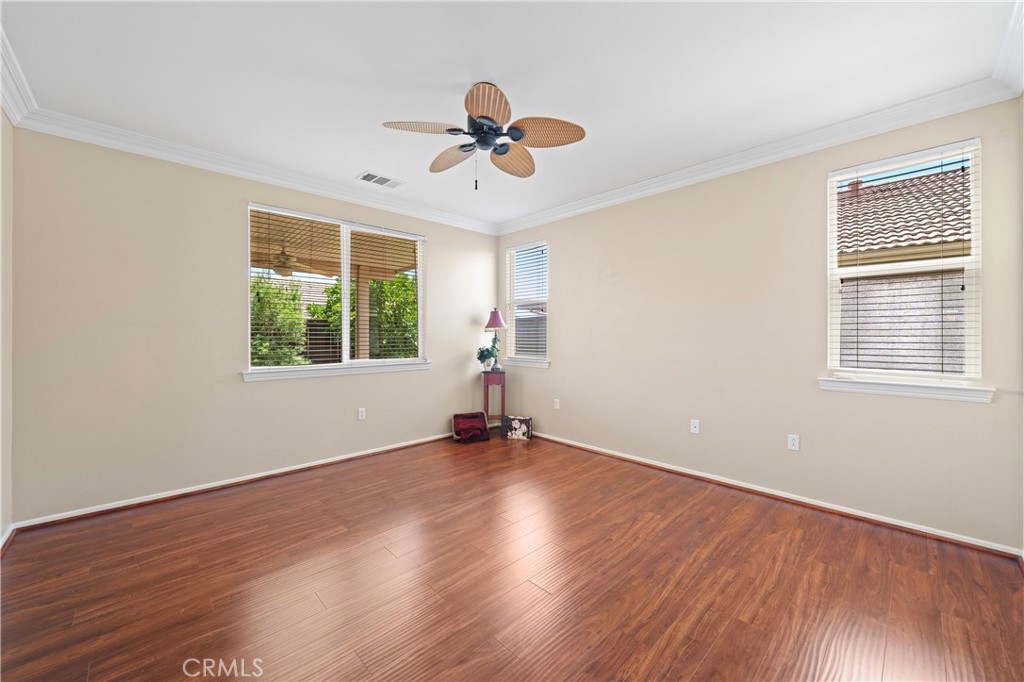 508 Casper Drive Hemet, CA 92545 - Photo 18 of 73 a view of empty room with wooden floor and fan