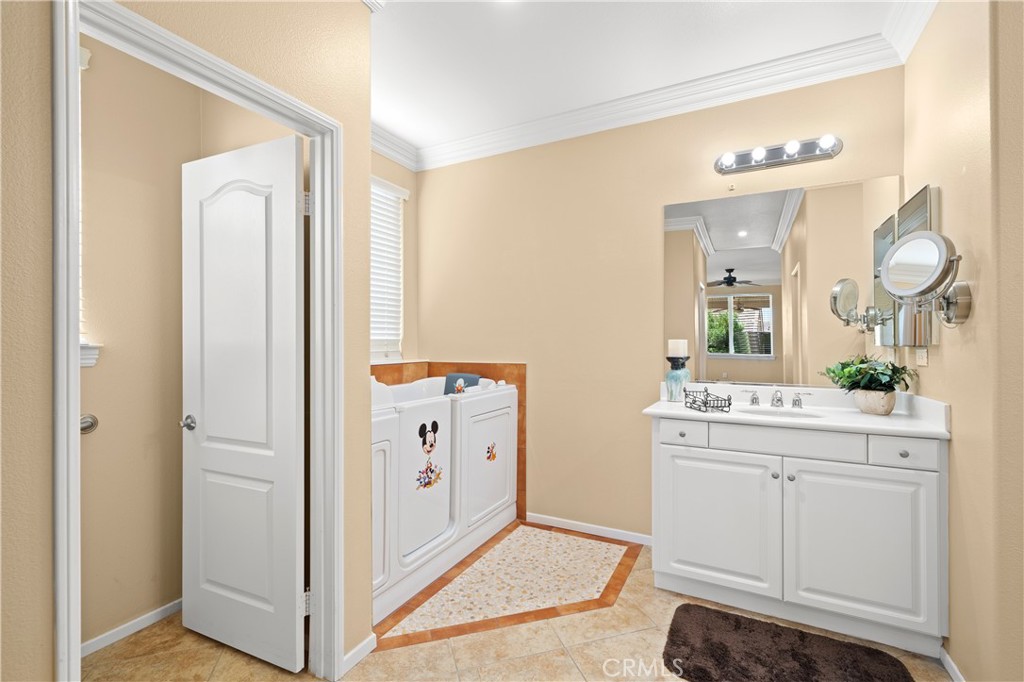 508 Casper Drive Hemet, CA 92545 - Photo 22 of 73 a bathroom with a sink vanity and a mirror