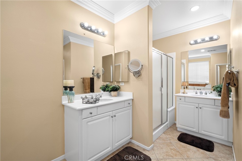 508 Casper Drive Hemet, CA 92545 - Photo 23 of 73 a bathroom with a sink a mirror and a shower