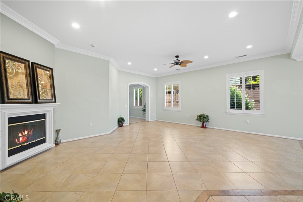 508 Casper Drive Hemet, CA 92545 - Photo 9 of 73 a view of an empty room with a fireplace and a window
