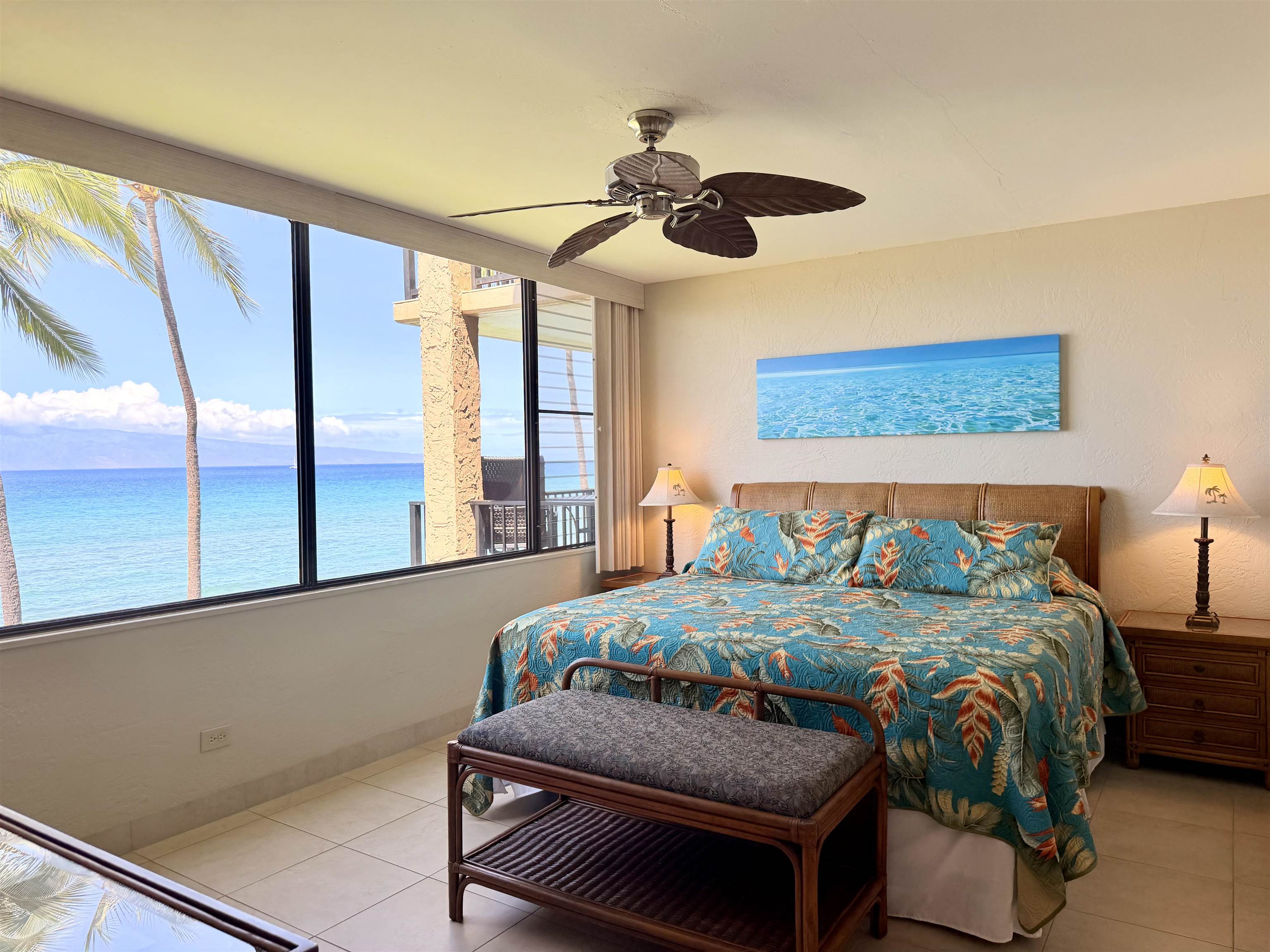3543 Lower Honoapiilani Road, Unit L302 Lahaina, HI 96761 - Photo 16 of 45 a bedroom with a bed and a chandelier