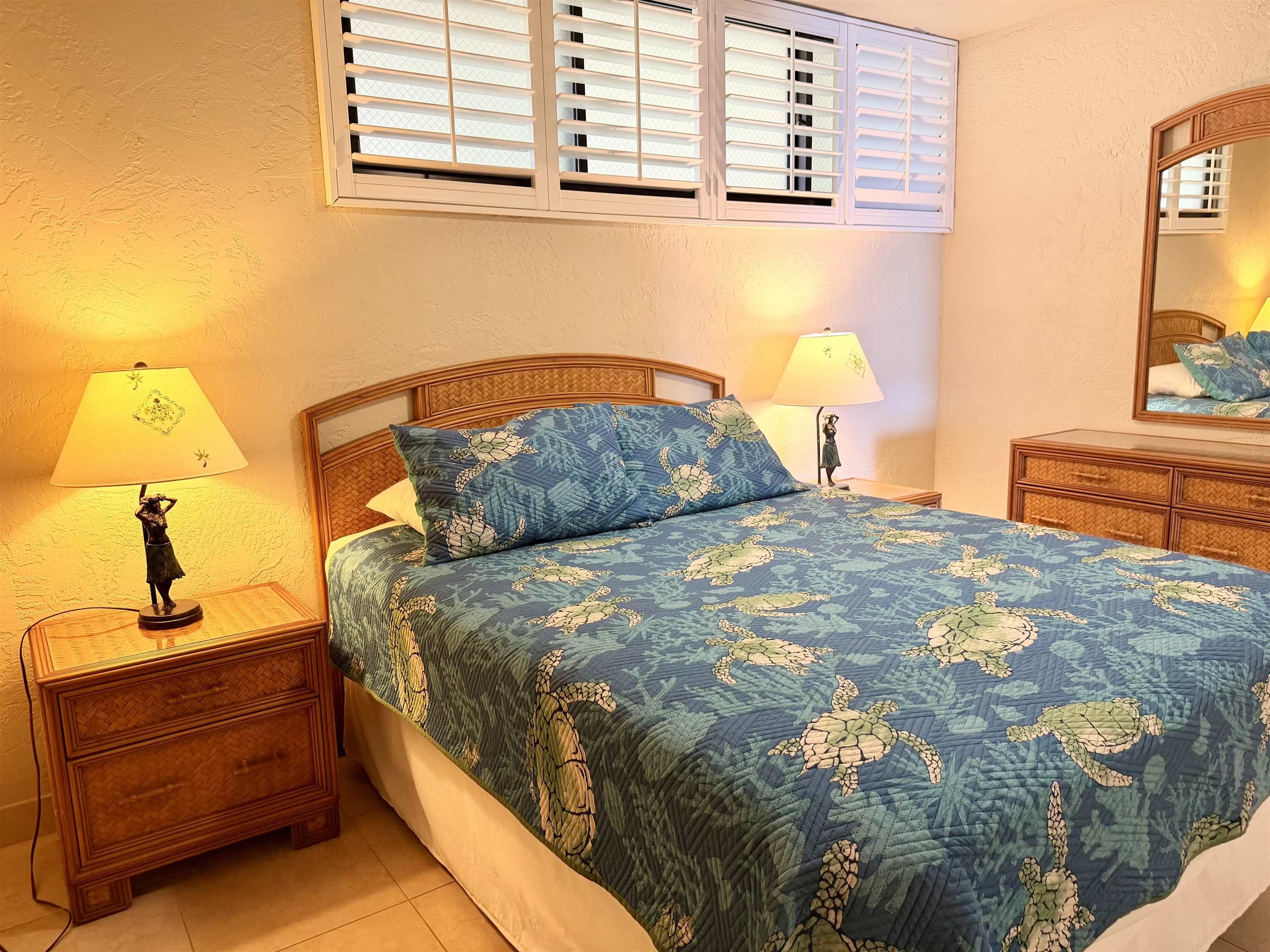 3543 Lower Honoapiilani Road, Unit L302 Lahaina, HI 96761 - Photo 25 of 45 a bedroom with a bed and a window