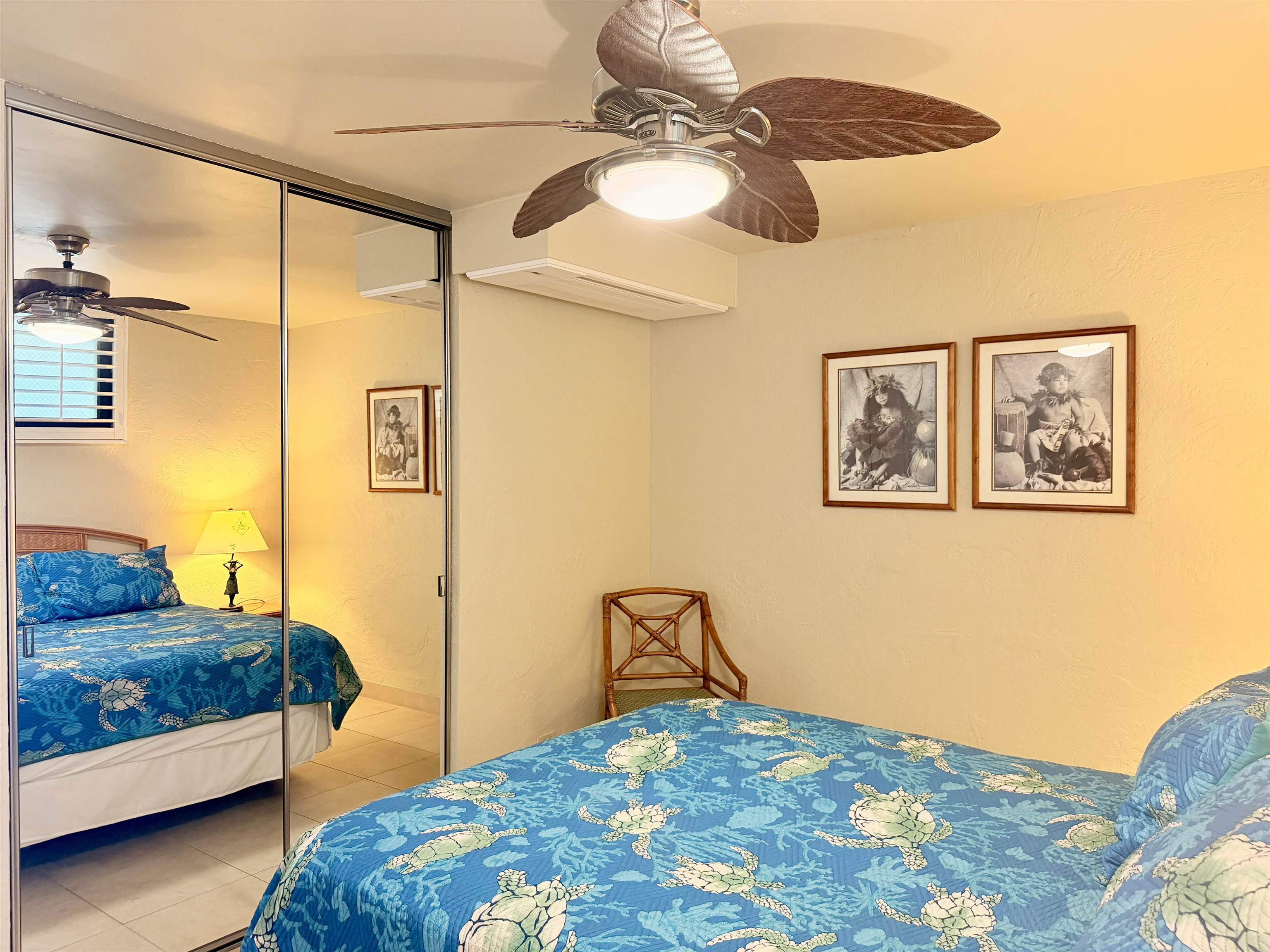 3543 Lower Honoapiilani Road, Unit L302 Lahaina, HI 96761 - Photo 27 of 45 a bedroom with a bed and lamp