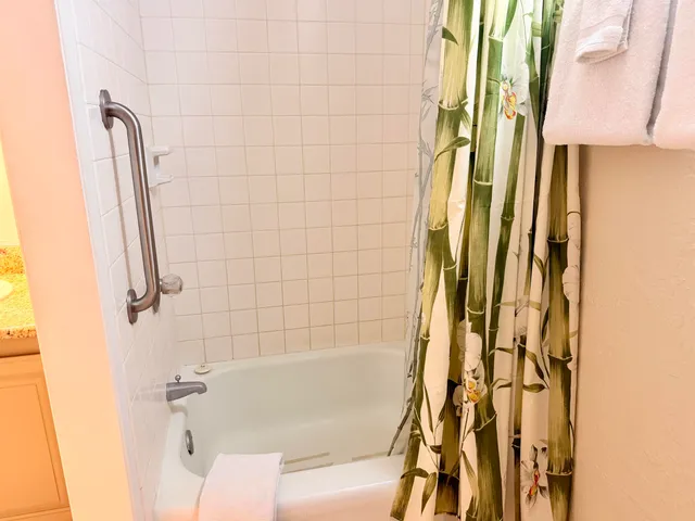 a bathroom with a bathtub and shower