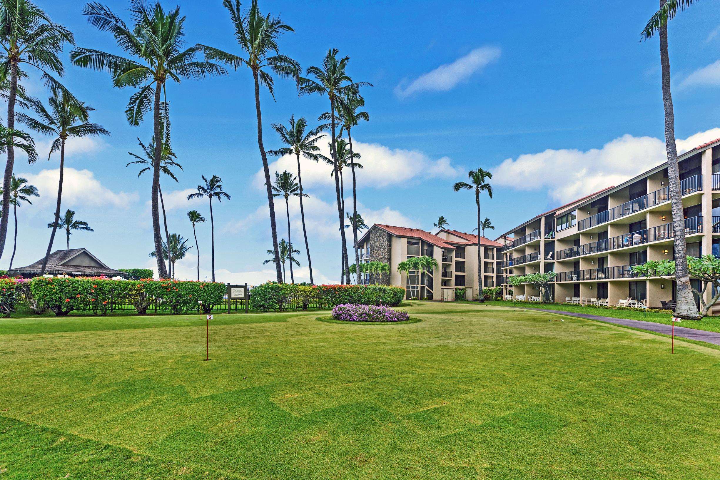 3543 Lower Honoapiilani Road, Unit L302 Lahaina, HI 96761 - Photo 43 of 45 a front view of a building with a garden