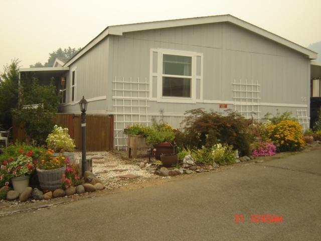 8401 Old Stage Road, Unit 55 Central Point, OR 97502 - Photo 1 of 18 Front entrance of home, completely fence