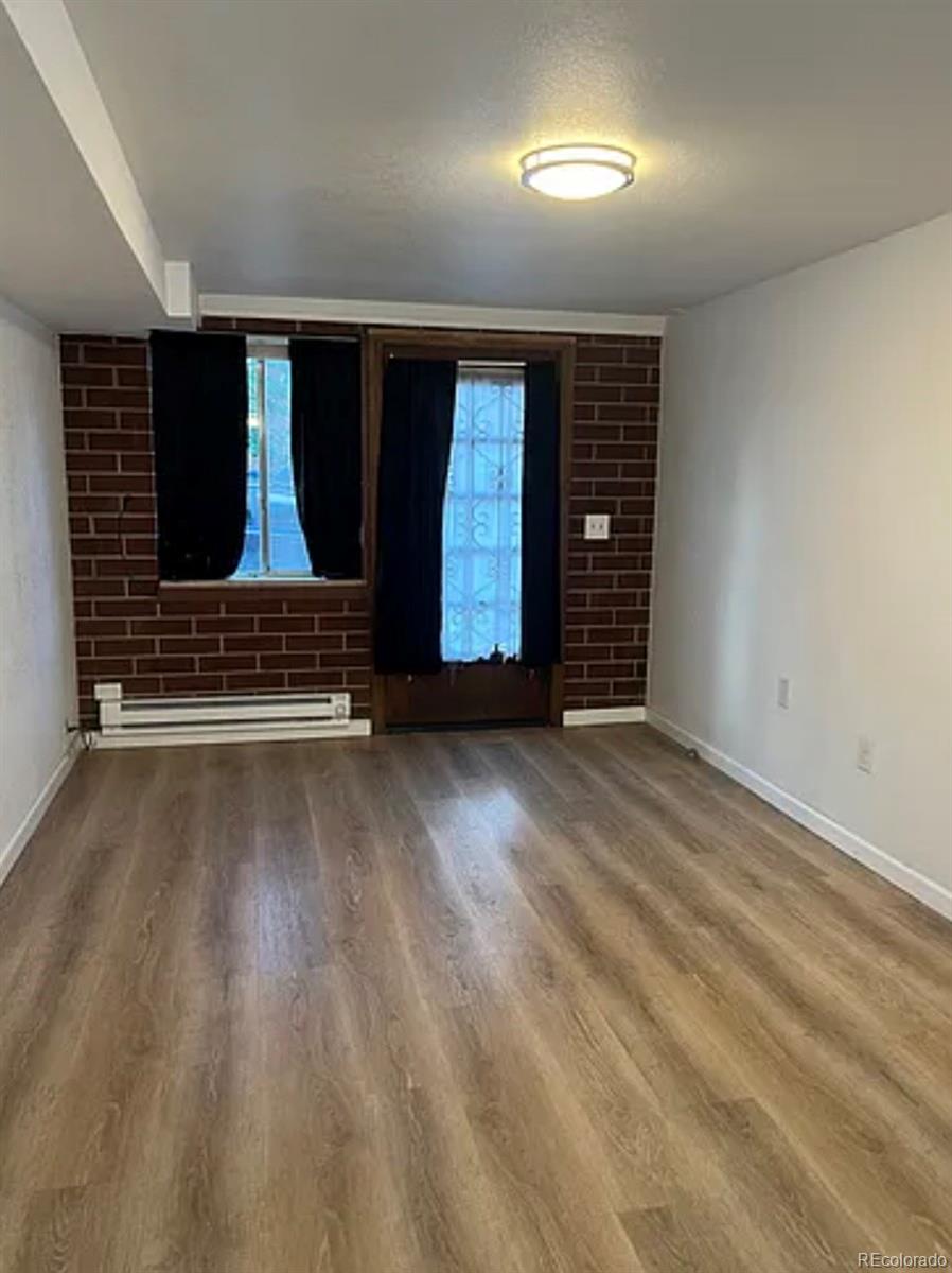 2201 South High Street, Unit 1030A Denver, CO 80210 - Photo 5 of 6 an empty room with windows and closet