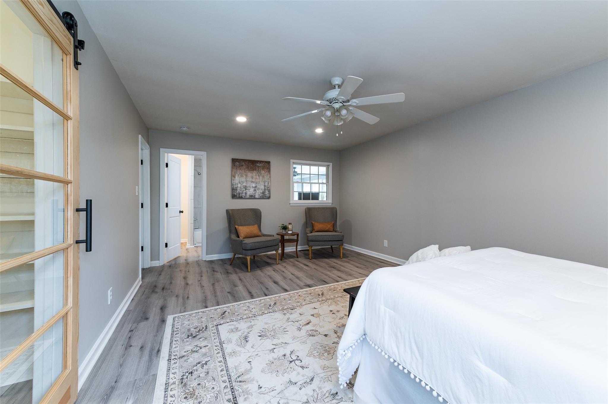 2715 Pineview Drive Lancaster, SC 29720 - Photo 23 of 40 a spacious bedroom with a bed a chair and glass door