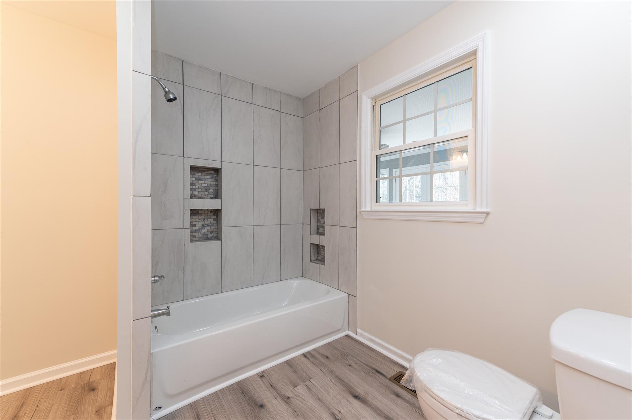 2715 Pineview Drive Lancaster, SC 29720 - Photo 26 of 40 a bathroom with a toilet and a bathtub