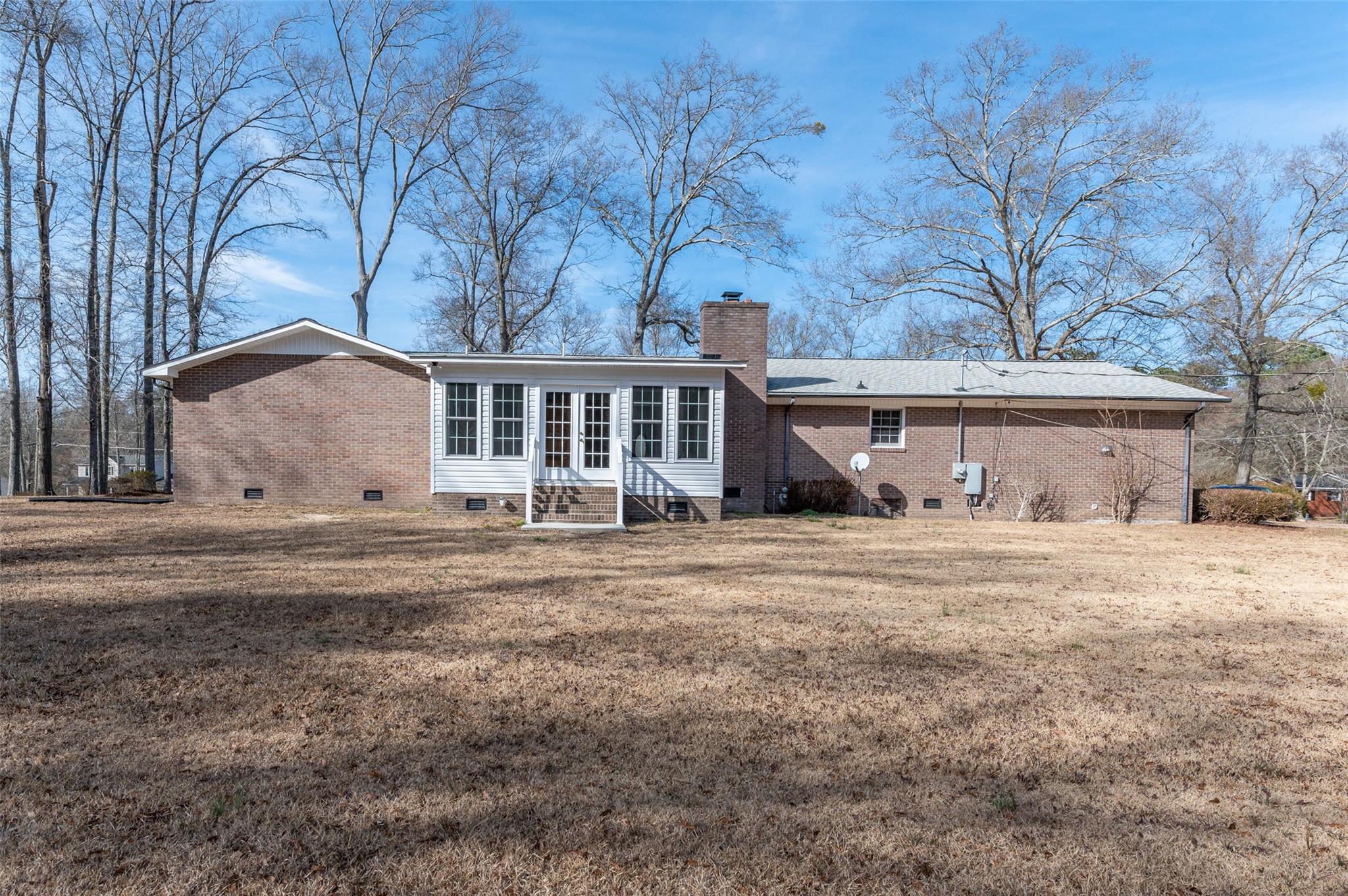 2715 Pineview Drive Lancaster, SC 29720 - Photo 33 of 40 a front view of a house with a garden and trees