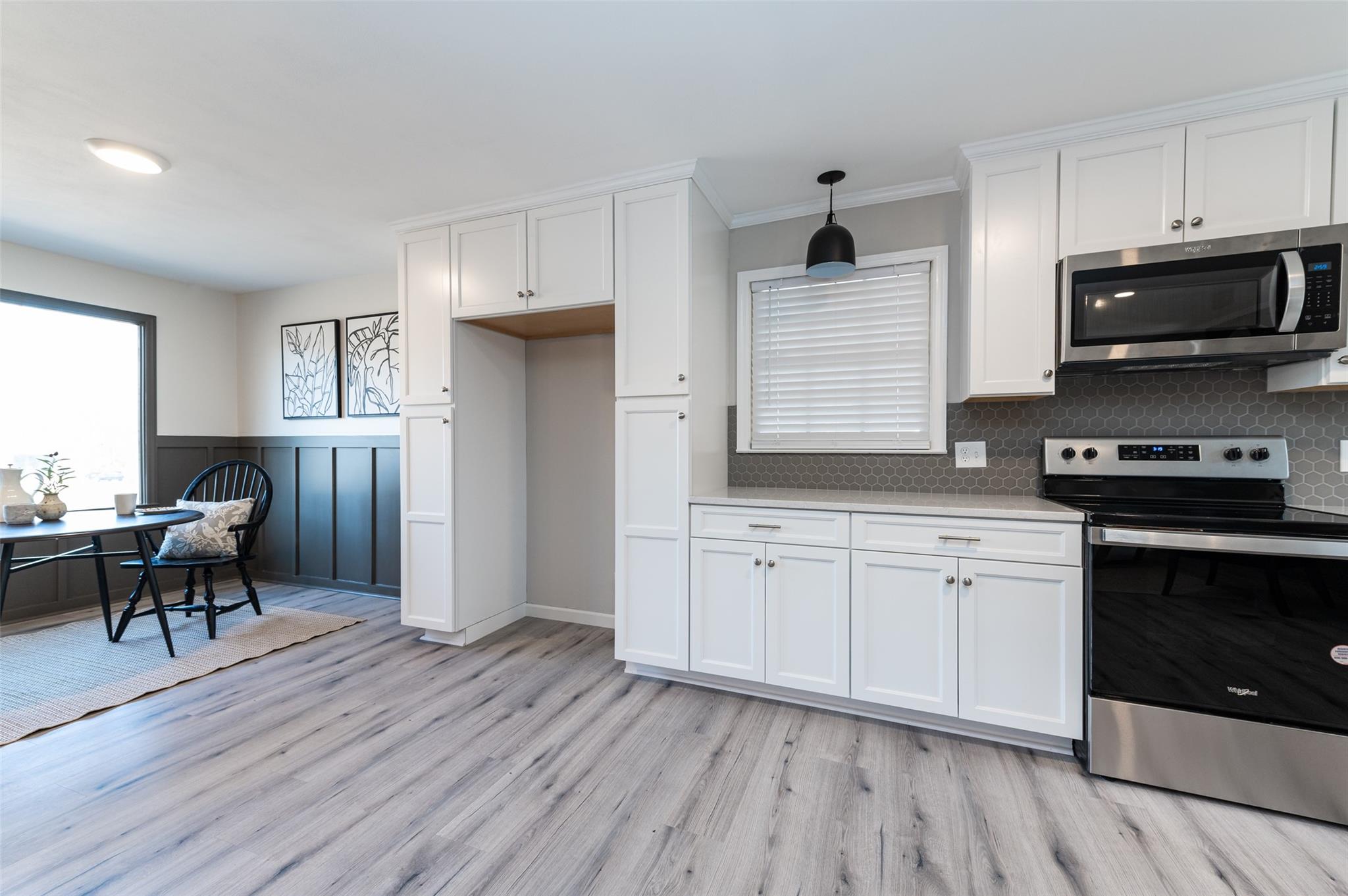 2715 Pineview Drive Lancaster, SC 29720 - Photo 9 of 40 a kitchen with stainless steel appliances granite countertop a stove a sink dishwasher and a refrigerator with wooden floor