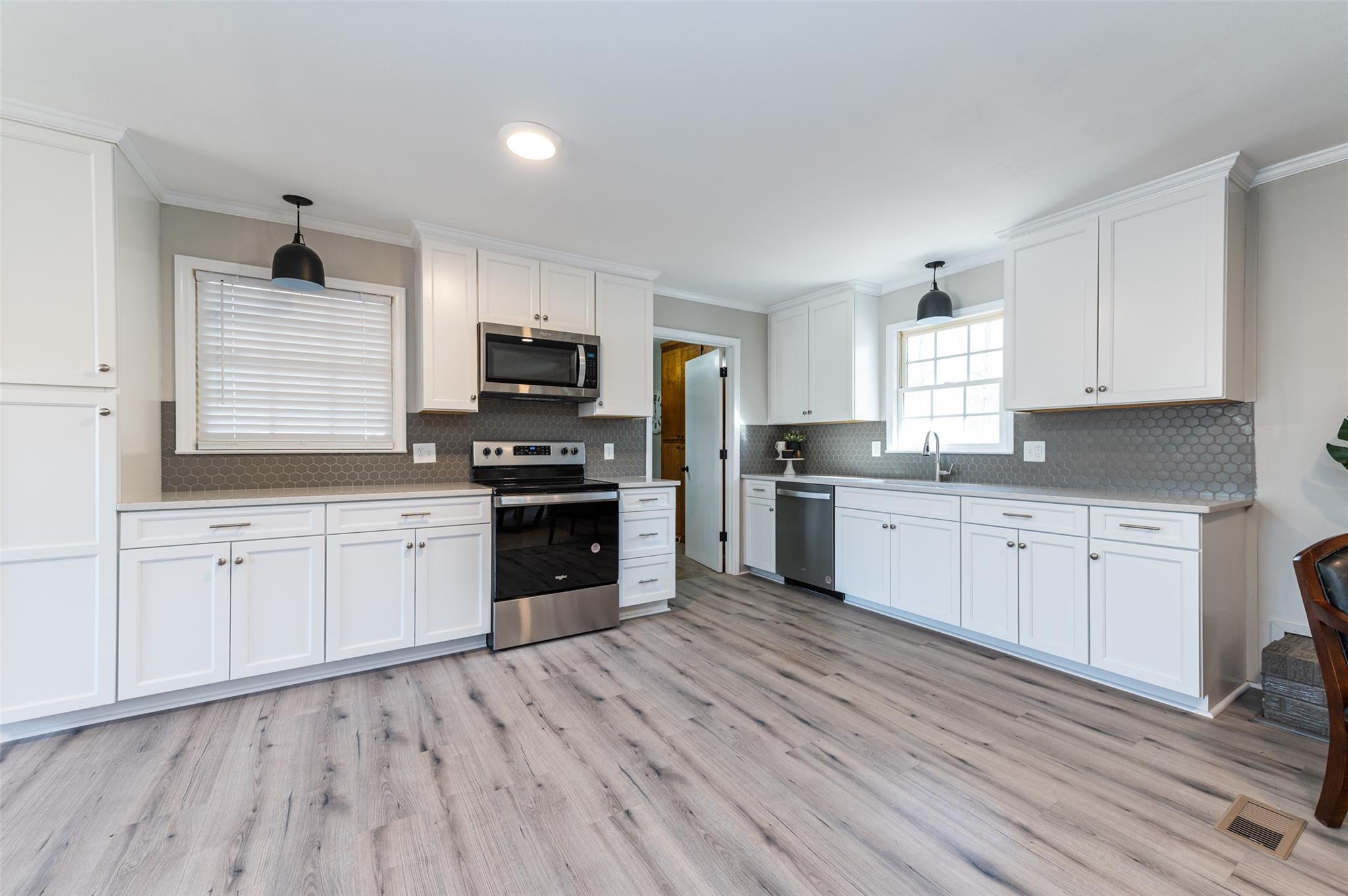 2715 Pineview Drive Lancaster, SC 29720 - Photo 10 of 40 a kitchen with granite countertop cabinets stainless steel appliances and a window