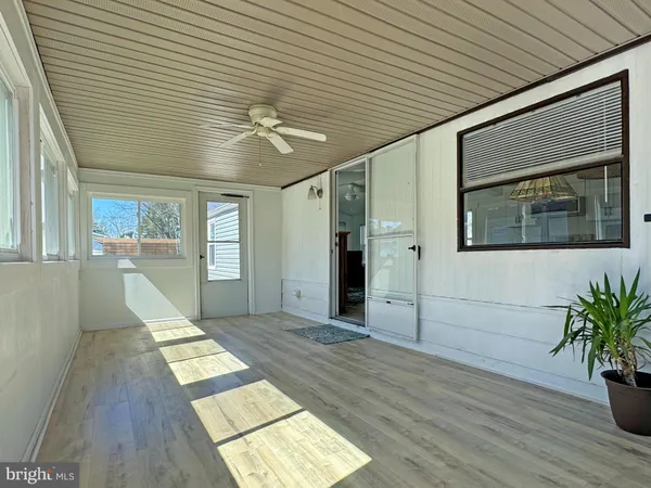 a sign board with buildings in the background