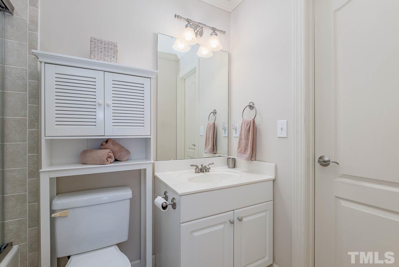 109 Nouveau Avenue Raleigh, NC 27615 - Photo 17 of 29 a bathroom with a sink a toilet and a mirror