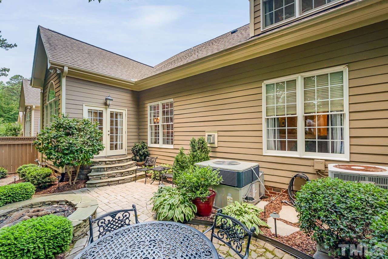 109 Nouveau Avenue Raleigh, NC 27615 - Photo 25 of 29 a front view of a house with a yard