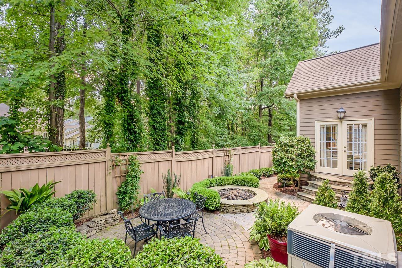 109 Nouveau Avenue Raleigh, NC 27615 - Photo 26 of 29 a view of backyard with outdoor seating and plants