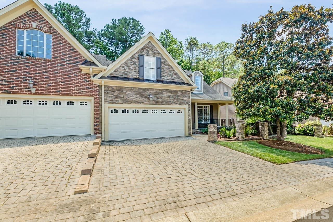 109 Nouveau Avenue Raleigh, NC 27615 - Photo 28 of 29 a front view of a house with a yard and garage