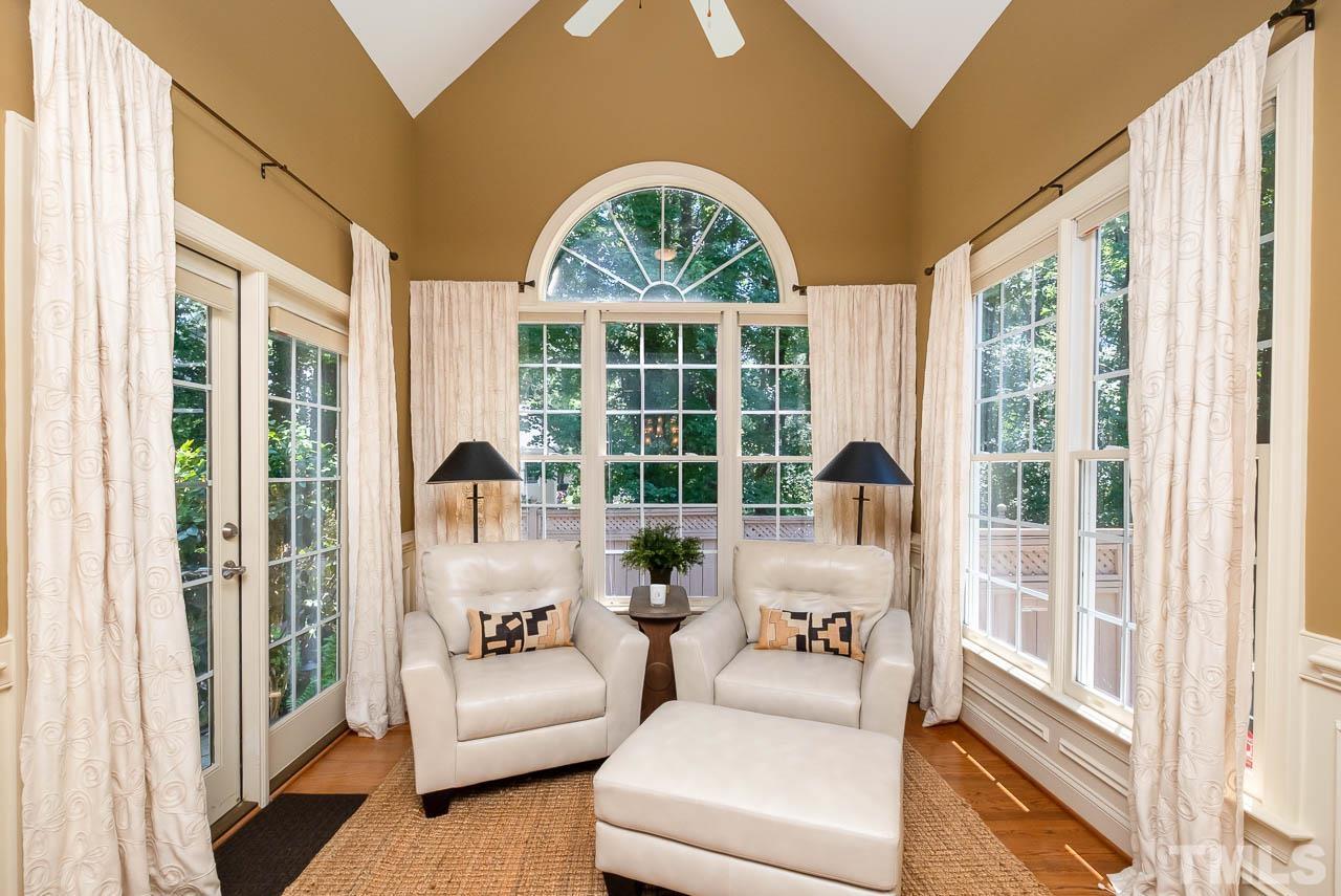 109 Nouveau Avenue Raleigh, NC 27615 - Photo 7 of 29 a living room with furniture and a large window