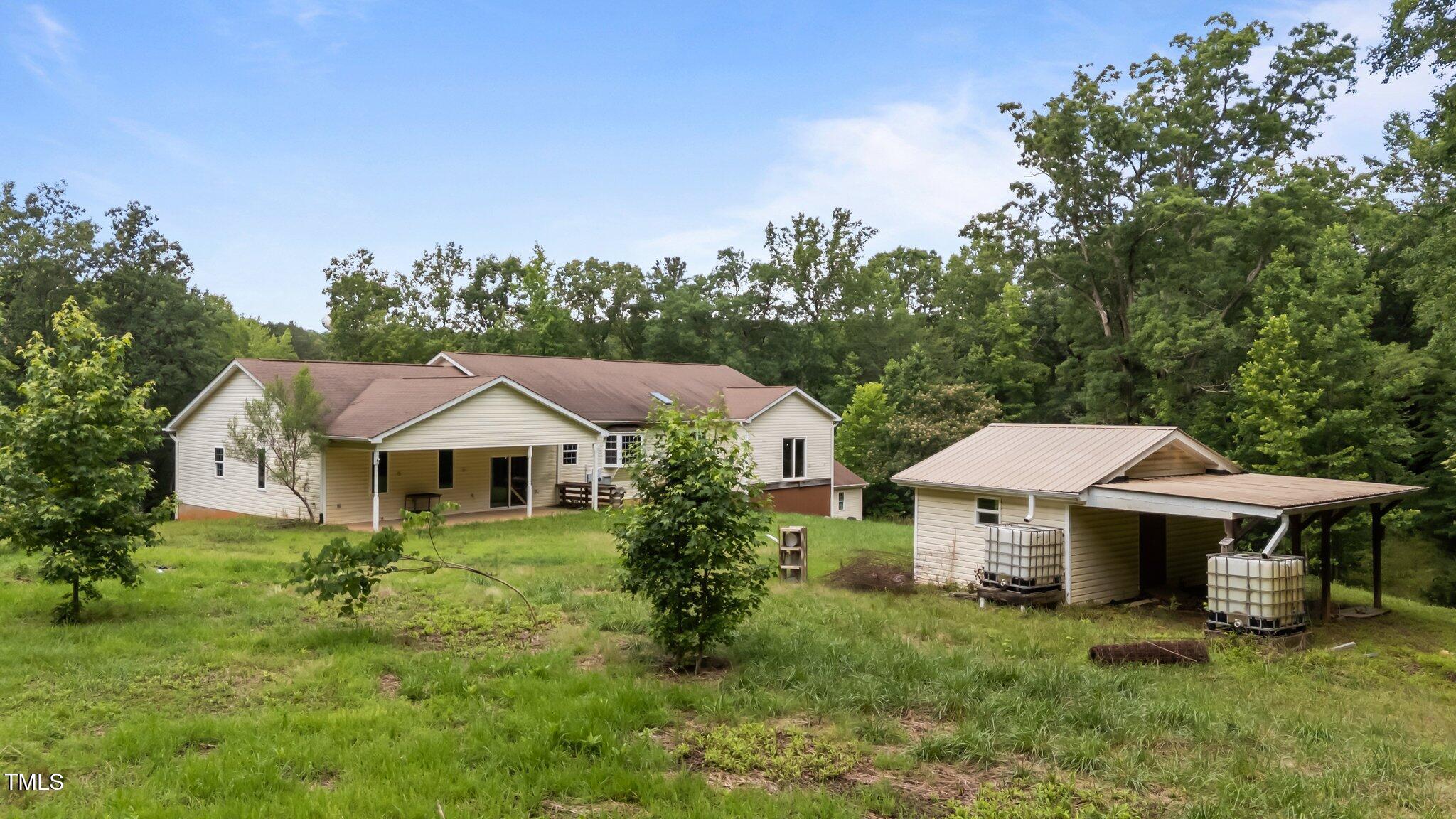 129 Shaman Drive Spring Hope, NC 27882 - Photo 4 of 33 a view of a house with garden and sitting area