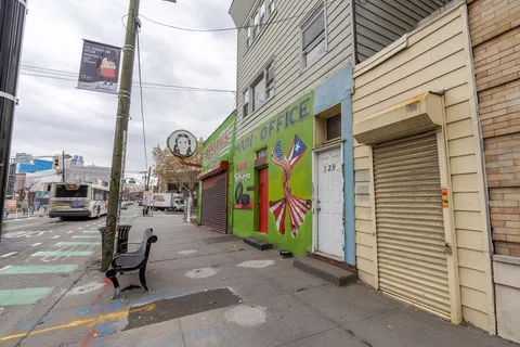 a view of a street with sitting area