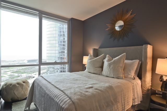 1201 South Prairie Avenue, Unit 804 Chicago, IL 60605 - Photo 12 of 13 a bedroom with a large bed and a large window
