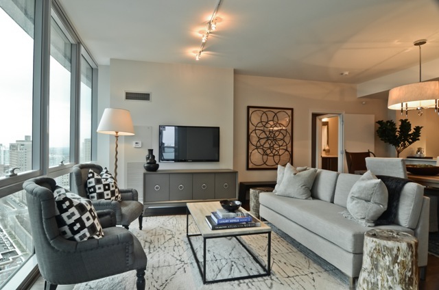 1201 South Prairie Avenue, Unit 804 Chicago, IL 60605 - Photo 4 of 13 a living room with furniture and a flat screen tv