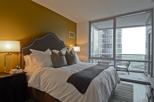 1201 South Prairie Avenue, Unit 804 Chicago, IL 60605 - Photo 9 of 13 a bed sitting in a bedroom next to a window