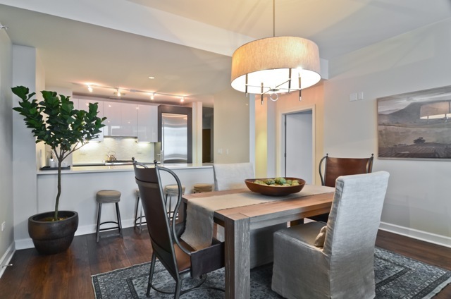 1201 South Prairie Avenue, Unit 804 Chicago, IL 60605 - Photo 10 of 13 a dining room with furniture and wooden floor