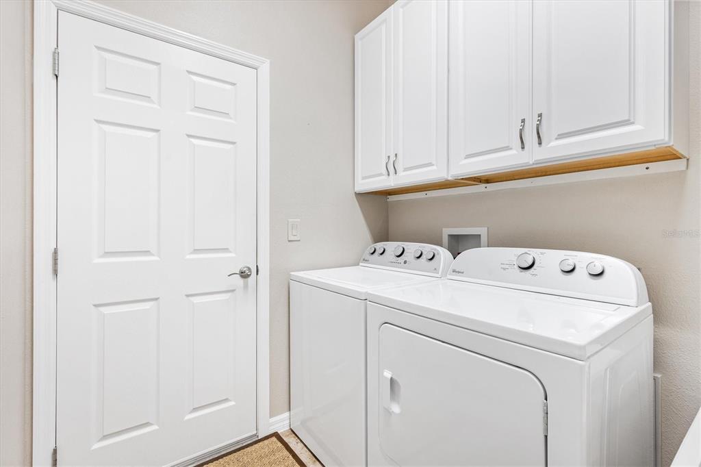 7351 Southeast 169th Cote Loop The Villages, FL 32162 - Photo 14 of 32 a utility room with dryer and washer