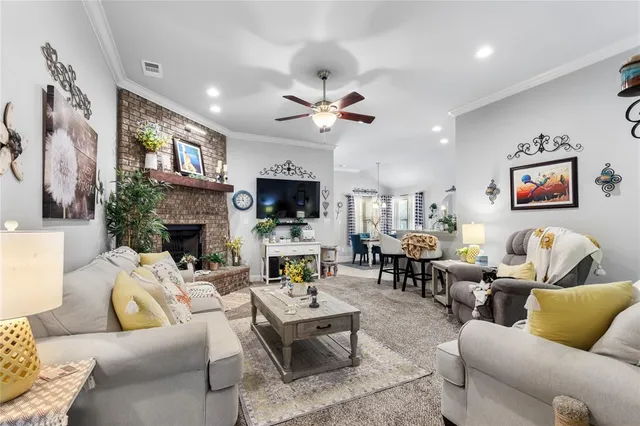 a living room with furniture fireplace and a flat screen tv