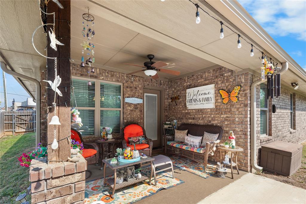 3016 Loy Lake Road Denison, TX 75020 - Photo 24 of 28 a living room with fireplace furniture and a potted plant